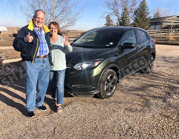 Happy couple in front of their sold Honda HRV